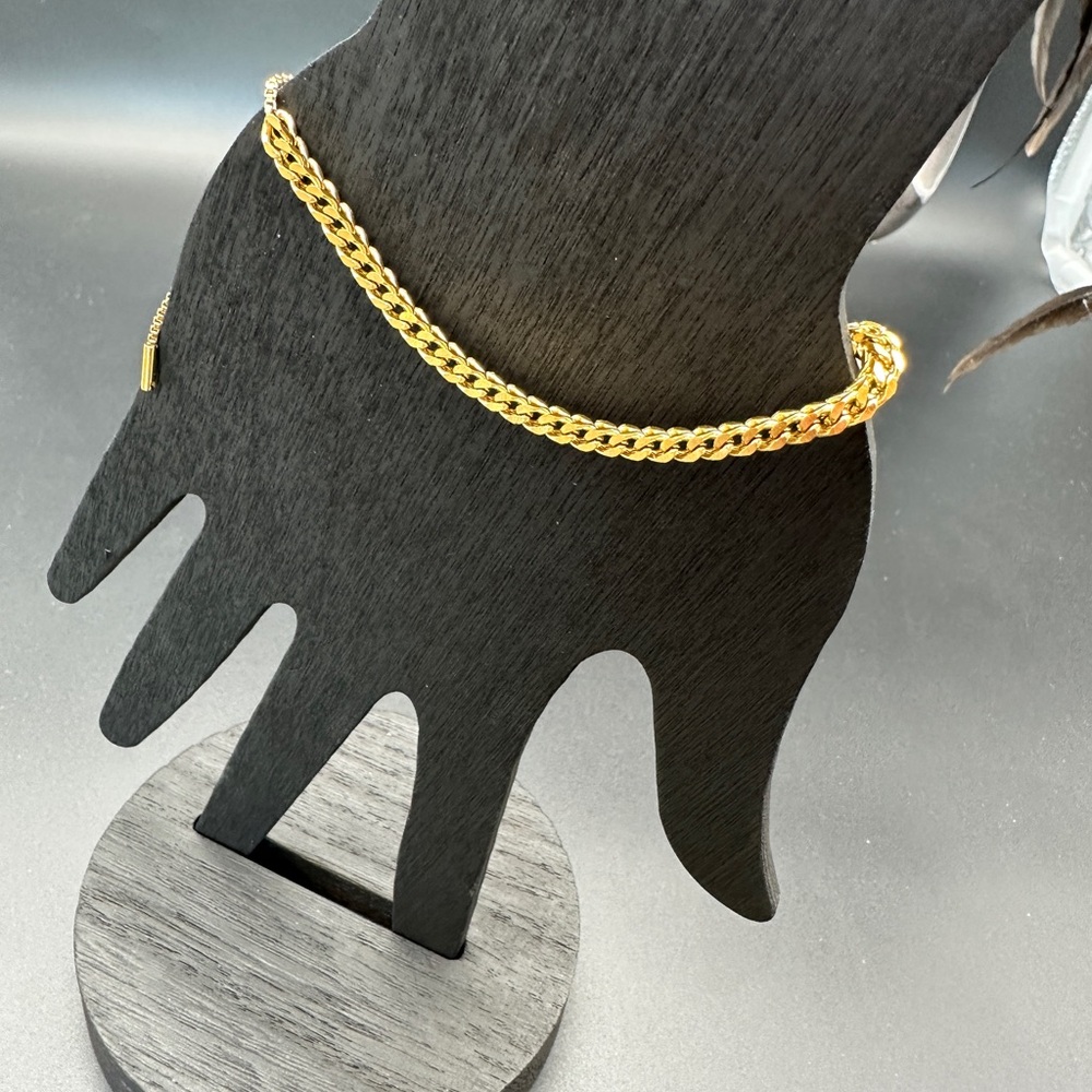 Gold Charm Bracelet with Intricate Design